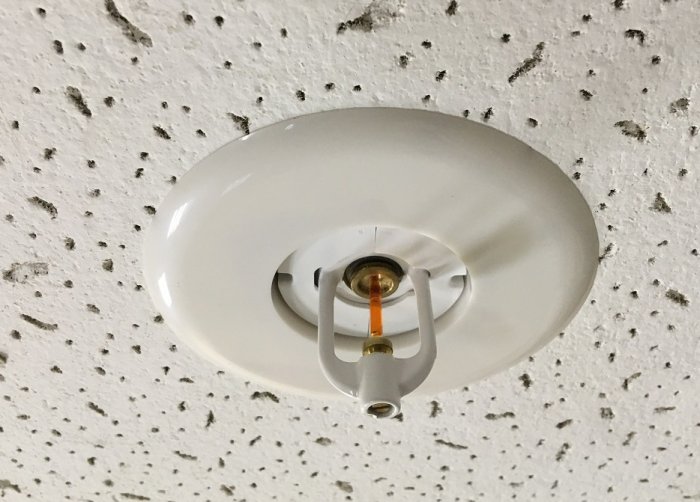 Escutcheon for flush installation of sprinklers